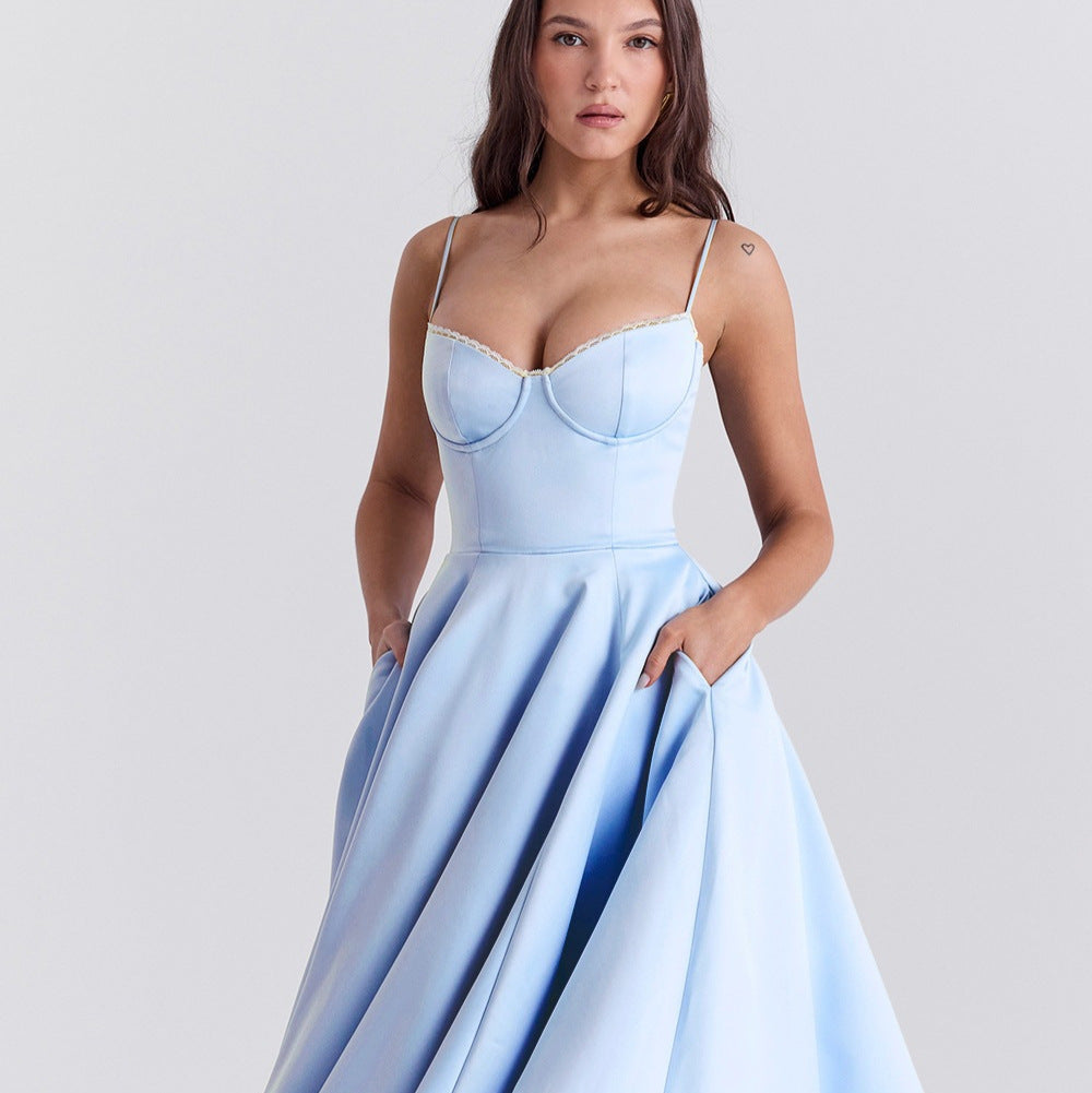 Woman wearing a light blue dress with a white background