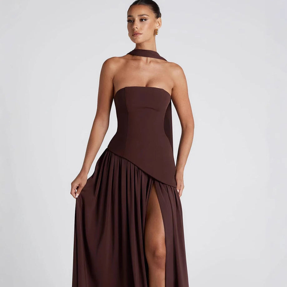 Woman wearing a brown strapless gown with a slit on a white background